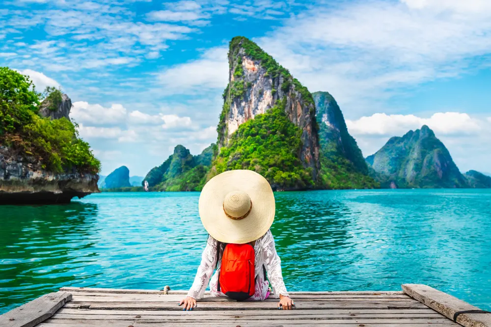 Luxury beach resort with palm trees, crystal clear turquoise water, and lounge chairs representing tropical paradise travel destination, ideal for hotel and tourism TV advertising campaigns to inspire vacation bookings and drive reservations.